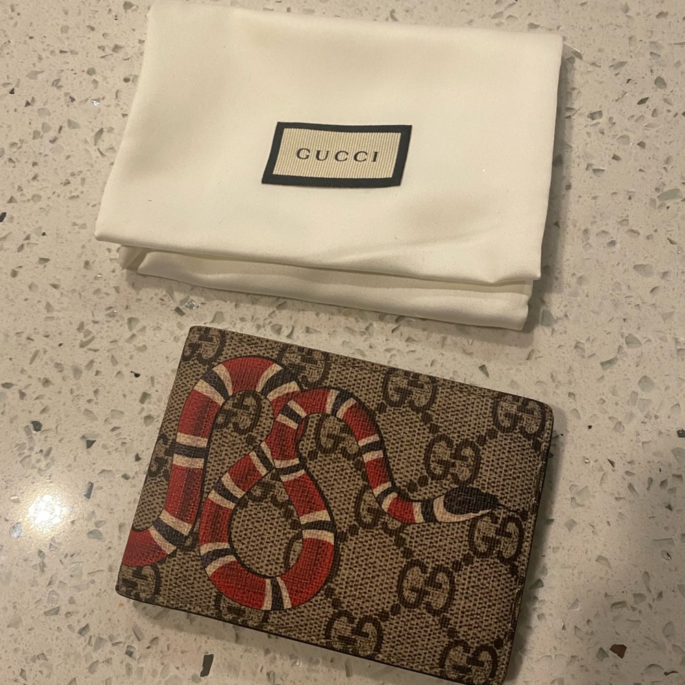 Gucci biFold wallet for sale.